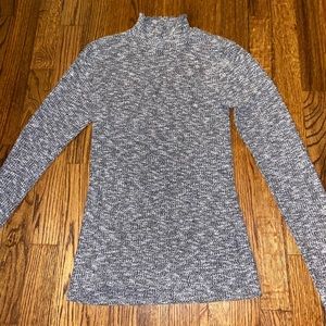 Gray ribbed turtle neck with lettuce trim